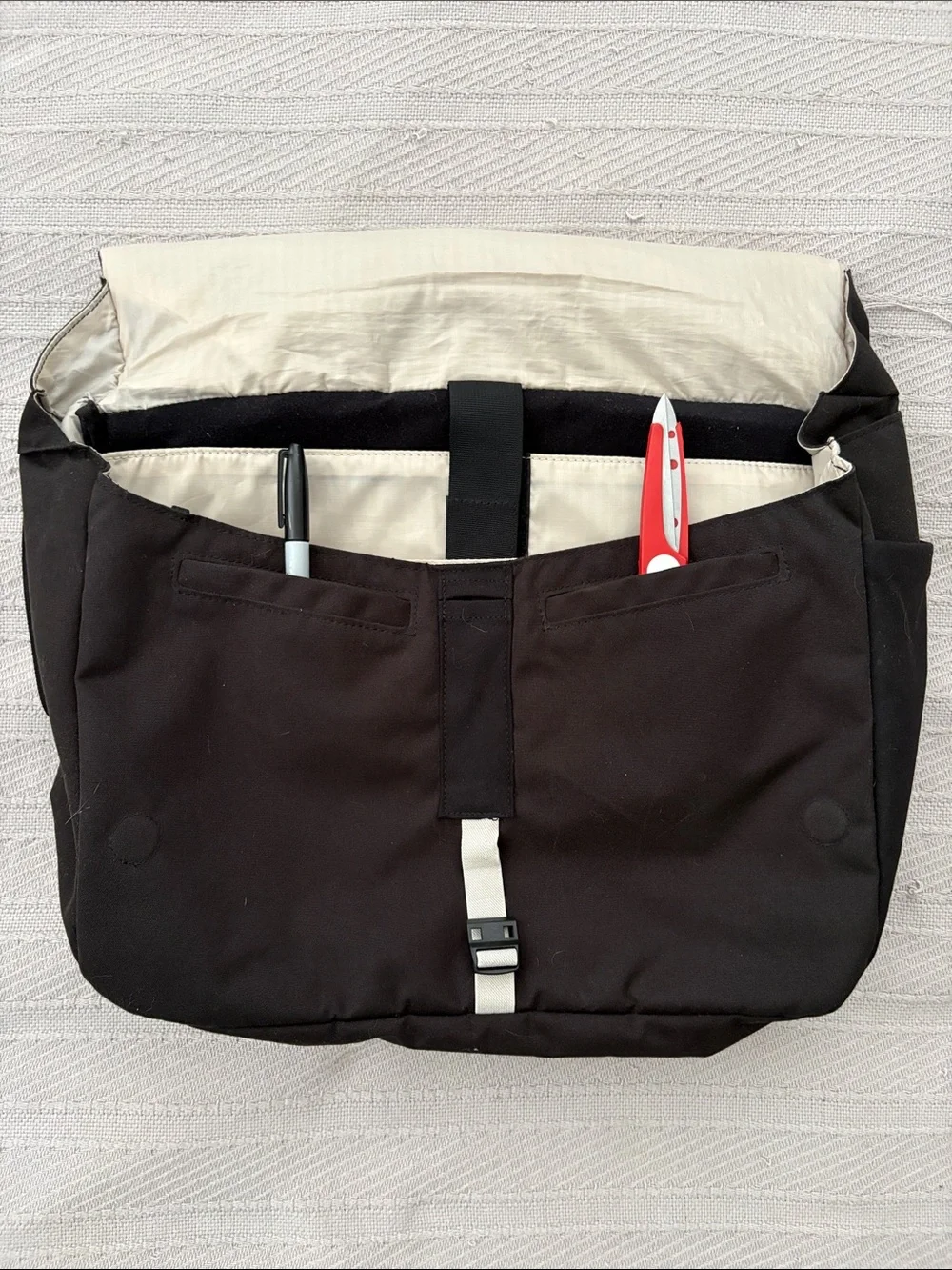 cotopaxi Black Messenger Bag with Cream Stripe